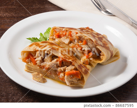 hearty pancake with chicken onions and carrots hearty pancake with chicken onions and carrots 86687595