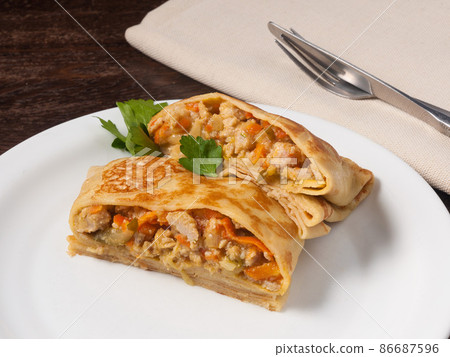 hearty pancake with chicken pickles onions and carrots hearty pancake with chicken pickles onions and carrots 86687596