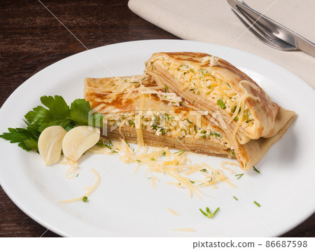 pancake khachapuri filled with cheese, herbs and garlic pancake khachapuri filled with cheese, herbs and garlic 86687598