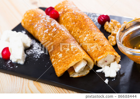 Bulgarian crepes Palatschinke on black board Bulgarian crepes Palatschinke on black board 86688444