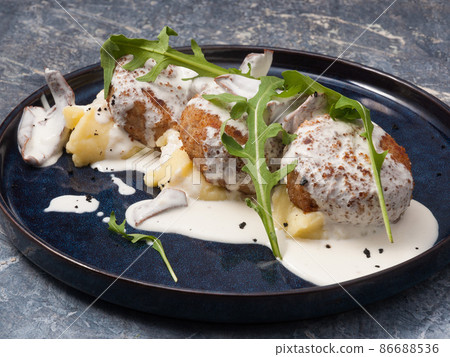 meat or chicken cutlets with mashed potatoes and mushroom sauce meat or chicken cutlets with mashed potatoes and mushroom sauce 86688536