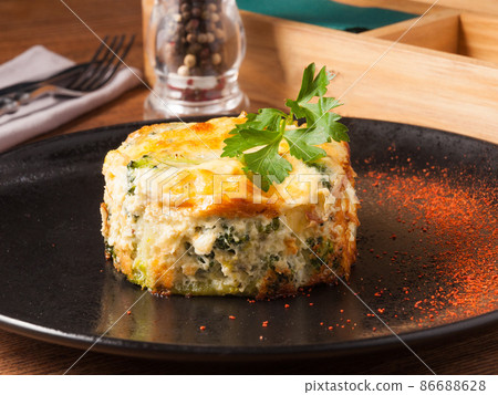 baked broccoli on a black plate in a restaurant. Concept 86688628