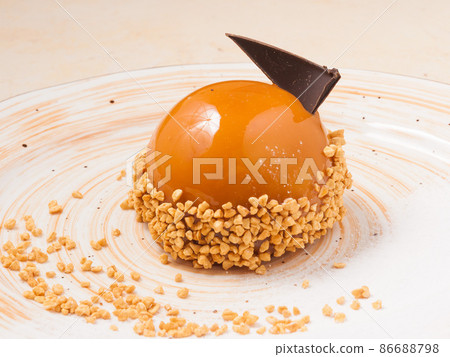 caramel cake glazed with decorated nut crumbs 86688798