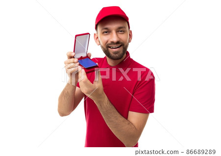 A delivery courier demonstrates a discount card in a case holding it forward, a middle-aged man with A delivery courier demonstrates a discount card in a case holding it forward, a middle-aged man with 86689289