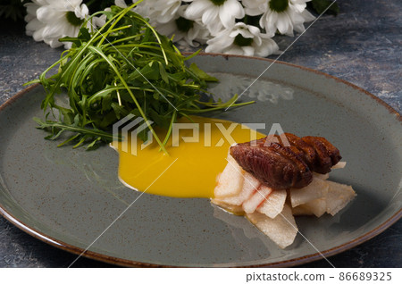 duck breast with caramelized pear and arugula duck breast with caramelized pear and arugula 86689325