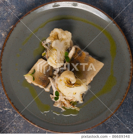 tasty baked pike-perch with cauliflower. Top view tasty baked pike-perch with cauliflower. Top view 86689348