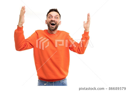 joyful happy man emotionally waving his hands gesturing with open mouth and smile joyful happy man emotionally waving his hands gesturing with open mouth and smile 86689379