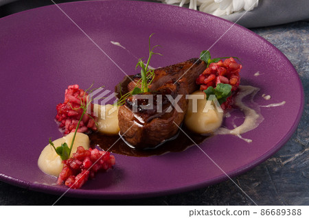 duck breast with strawberry tartare. Horizontal frame 86689388