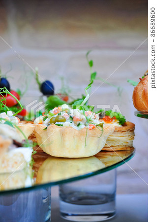tartlet with salad Olivier at the reception. close up 86689600