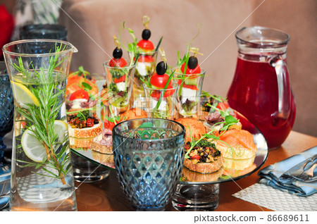 snacks and drinks at the buffet in the restaurant 86689611