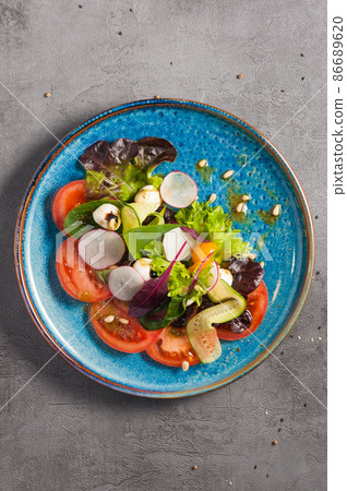 Caprese salad on a grey background. top view Caprese salad on a grey background. top view 86689620