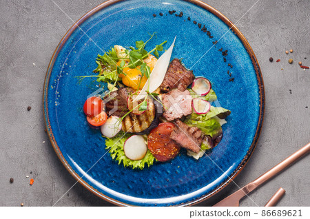 grilled salad with beef, eggplant, tomatoes and bell pepper. Top view grilled salad with beef, eggplant, tomatoes and bell pepper. Top view 86689621