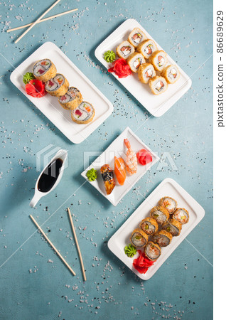assorted sushi and rolls with soy sauce. Top view assorted sushi and rolls with soy sauce. Top view 86689629