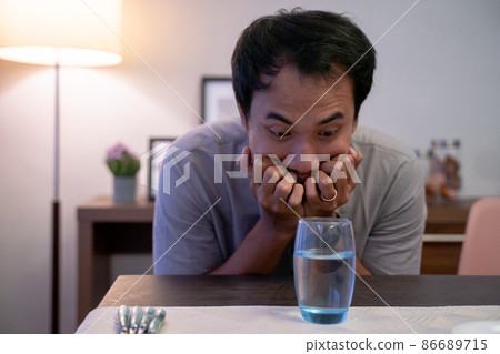 impatient muslim male waiting to break his fast and drink impatient muslim male waiting to break his fast and drink 86689715