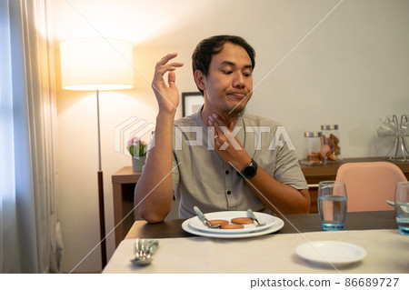 impatient muslim male waiting to break his fast impatient muslim male waiting to break his fast 86689727