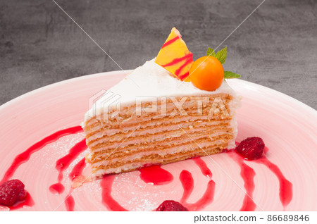 honey cake decorated with physalis and raspberries honey cake decorated with physalis and raspberries 86689846