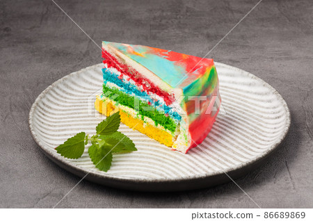 piece of rainbow sponge cake with cream piece of rainbow sponge cake with cream 86689869