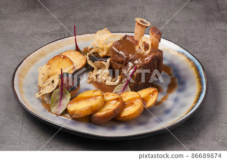 stewed beef rib with new potatoes and onions stewed beef rib with new potatoes and onions 86689874