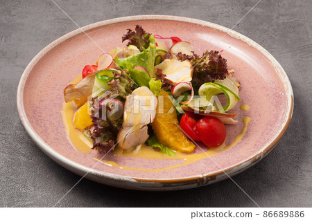 salad with duck, orange, vegetables and mango sauce 86689886