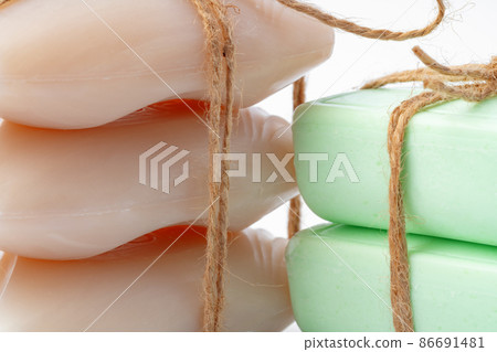 Beige and green soap bars on white background Beige and green soap bars on white background 86691481