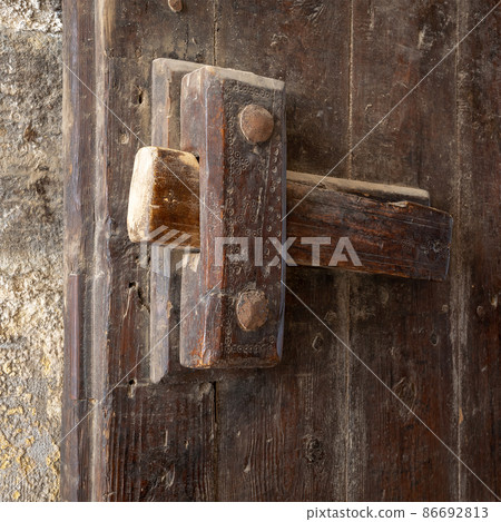 Closeup of a wooden aged latch Closeup of a wooden aged latch 86692813