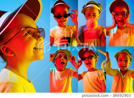 Learning to show feelings. Photo set of images of little kid, cute girl isolated on blue studio background in neon light. Education, emotions Learning to show feelings. Photo set of images of little kid, cute girl isolated on blue studio background in neon light. Education, emotions 86692903