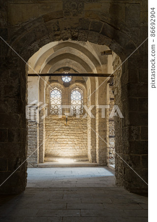 Vaulted passage leading to a wall with two adjacent windows at the Qalawun complex Vaulted passage leading to a wall with two adjacent windows at the Qalawun complex 86692904