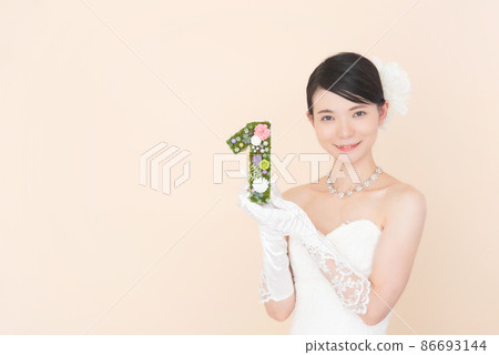 Female in a wedding dress with the number 1 86693144