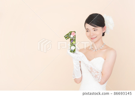 Female in a wedding dress with the number 1 86693145