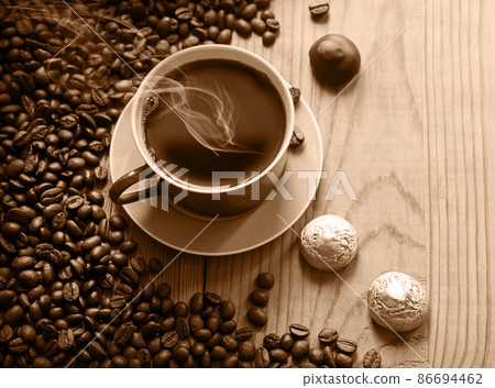 Sweets on the background of coffee on the table Sweets on the background of coffee on the table 86694462