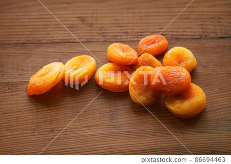 Dried fruits on a wooden table Dried fruits on a wooden table 86694463