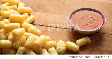 Corn sticks on wooden background 86694481
