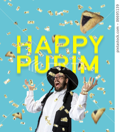 Bright contemporary art collage with happy young orthodox jewish man during festival purim. Holiday, celebration, tradition, ad concept. 86695139