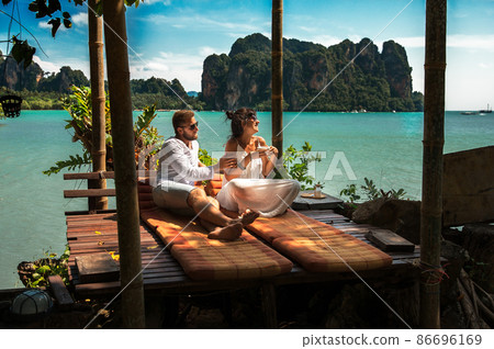 Couple on their honeymoon. Couple travels the world. Happy couple on vacation. Man and woman traveling to Thailand. Holidays on beautiful Islands. Tourists on vacation. Trip to the islands 86696169
