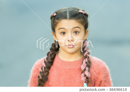 Girl with braided hair style with pink kanekalon. Girl with braided hair style with pink kanekalon. 86696618