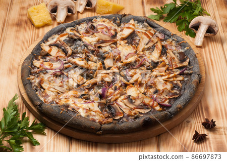 pizza with chicken and mushrooms and teriyaki sauce on black dough pizza with chicken and mushrooms and teriyaki sauce on black dough 86697873