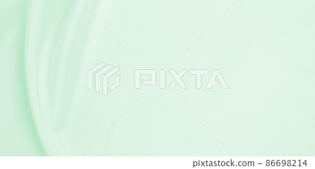 Smooth elegant green silk or satin luxury cloth texture as abstract background. Luxurious background design 86698214