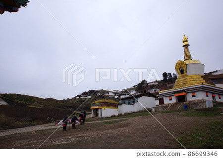 Chorten and Tibetans in Langmusi, Amdo, Tibet 86699346