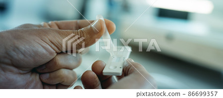 having a covid-19 test in the office, web format having a covid-19 test in the office, web format 86699357