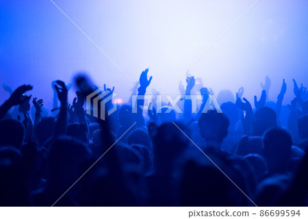 Crowd of people clubbing at live concert 86699594