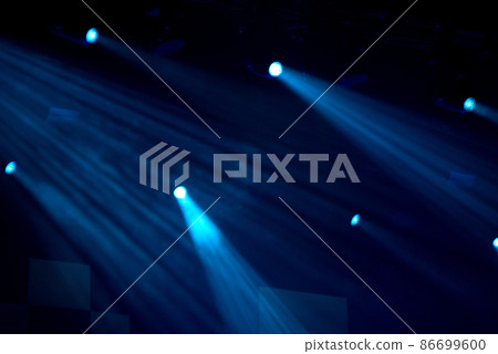 Stage lights glowing in the dark 86699600