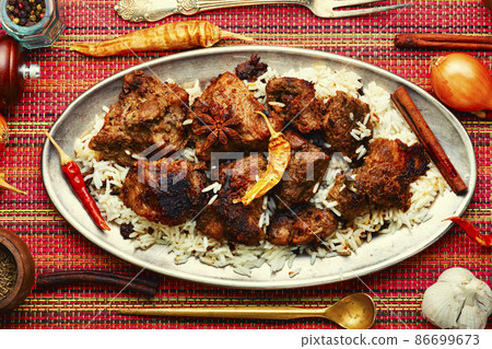 Pork vindaloo, a popular Indian dish. 86699673