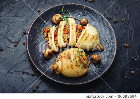 Tasty grilled squid with mushrooms filling Tasty grilled squid with mushrooms filling 86699694