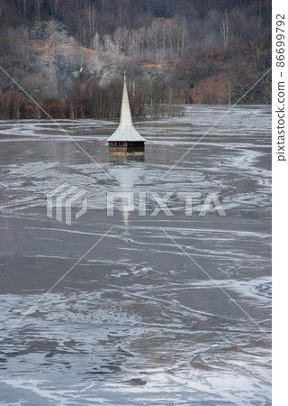 Church flooded and submerged by toxic waste waters from a copper and gold mine. Geamana, Rosia Montana, Romania 86699792