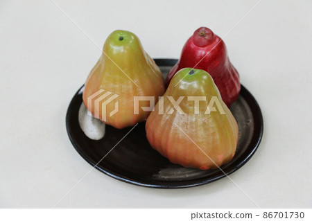 Rose apple on a plate Rose apple on a plate 86701730