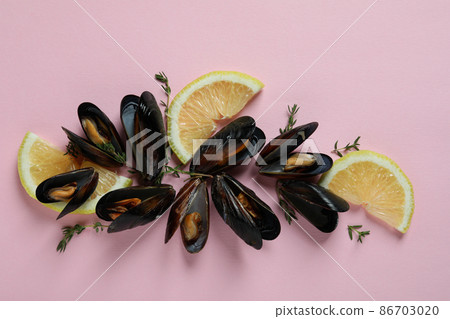 Fresh mussels on pink background, top view Fresh mussels on pink background, top view 86703020