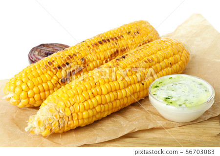 Tasty grilled corn isolated on white background Tasty grilled corn isolated on white background 86703083
