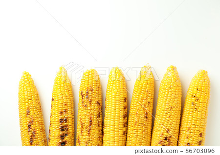 Concept of tasty food with grilled corn Concept of tasty food with grilled corn 86703096