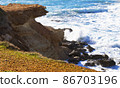 Ocean waves splash against beach with rocks background, Cliffs in the sea, Top aerial view of Cyprus, Nature Background with Sea, Vacation and relax 86703196