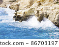 Ocean waves splash against beach with rocks background, Cliffs in the sea, Top aerial view of Cyprus, Nature Background with Sea, Vacation and relax 86703197